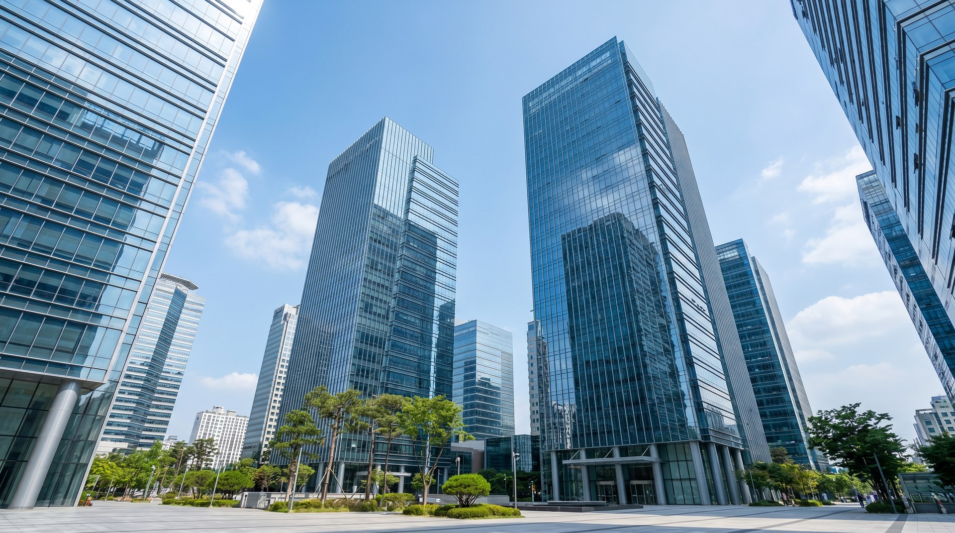 AEROCLAD Smoke Duct · High-Rise Office Application · Modern Korean glass-curtain-wall skyscrapers representing 30+ floor stairwell pressurization context